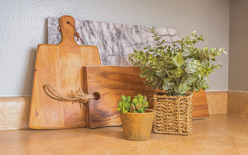 cutting board with plants on a table
