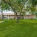 large area of green grass and picnic table