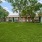 large area of green grass and picnic table