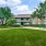large area of green grass and picnic table